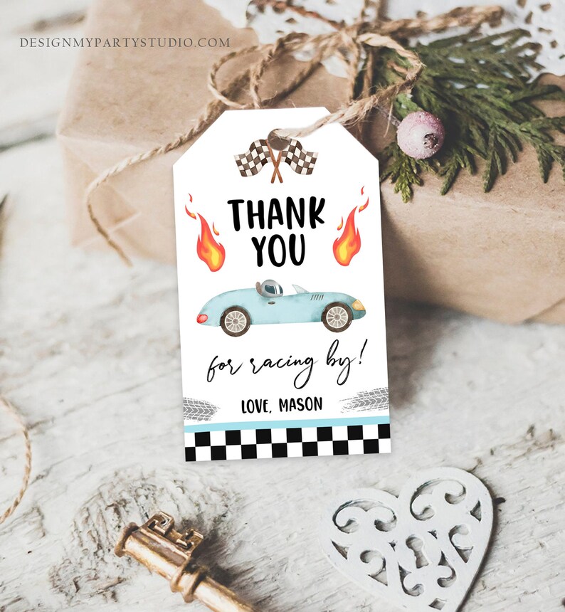 May include: A blue and white thank you tag with a cartoon race car, checkered flags, and flames. The text reads "Thank You for racing by! Love, Mason".