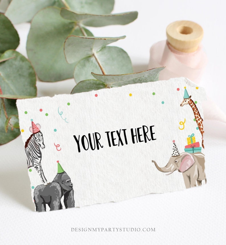 May include: A white card with a colorful confetti background and a zebra, gorilla, elephant, and giraffe wearing party hats. The text "YOUR TEXT HERE" is in the center of the card.