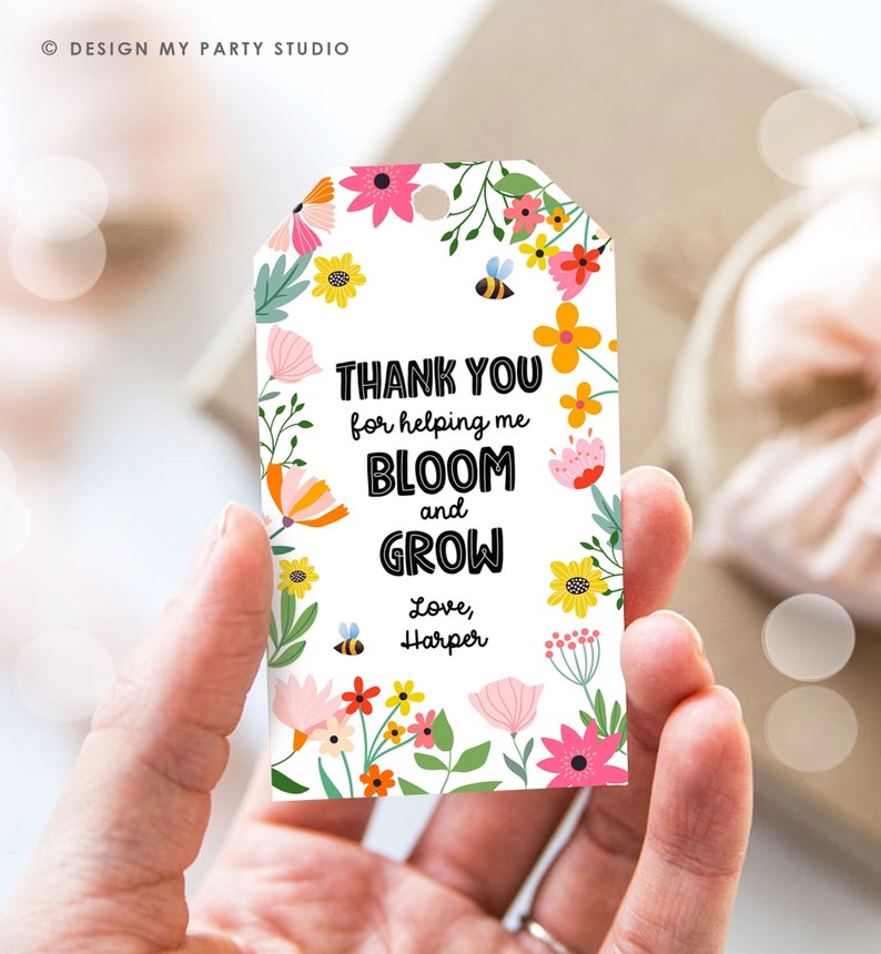 May include: A white gift tag with a floral border and the text "THANK YOU for helping me BLOOM and GROW Love, Harper".
