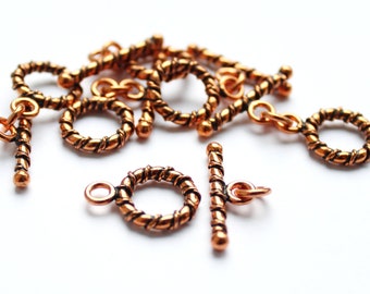 6 toggle closures; ring bar clasps; copper-colored, shiny, blackened copper; Ring 13 x 3 mm, rod 23 x 3 mm
