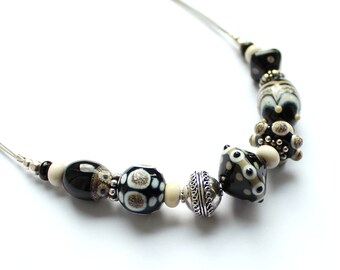 Glass bead necklace "black-natural-sand" made of Murano glass with real silver beads from Bali, stainless steel, 925 silver; handmade by PERSICO