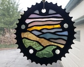 Stained glass bike chain ring mountain sunset