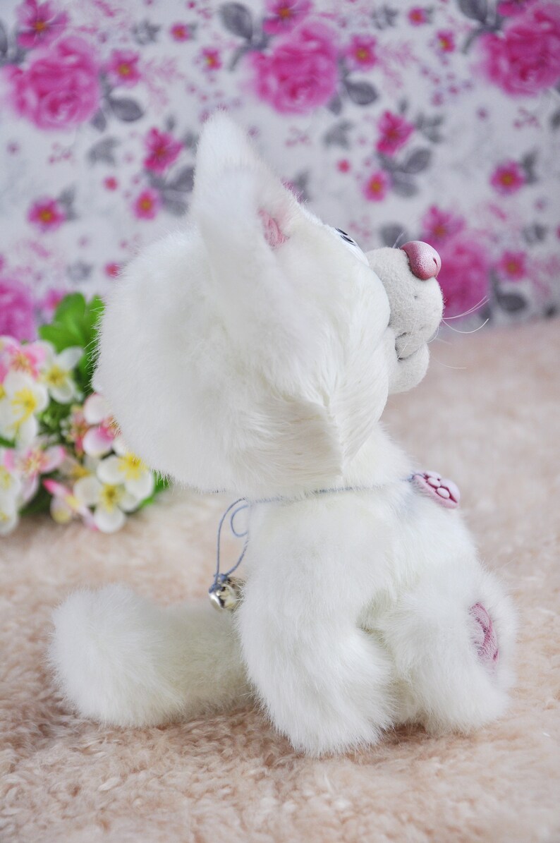 white soft toy cat