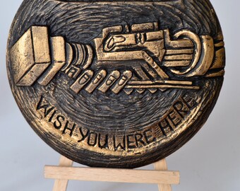 Wish You Were Here rock art sculpture in gold color