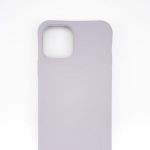 May include: A light purple silicone phone case with a raised camera bump and the word "casetify" printed on the bottom right corner.