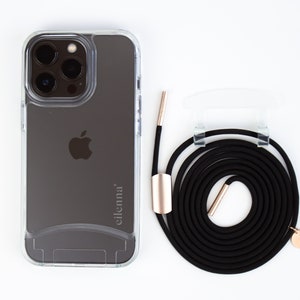 May include: A clear phone case with a black phone inside. The phone has a triple lens camera and the Apple logo on the back. The case has the word "eilenna" printed on the back. A black phone strap with gold accents is included.