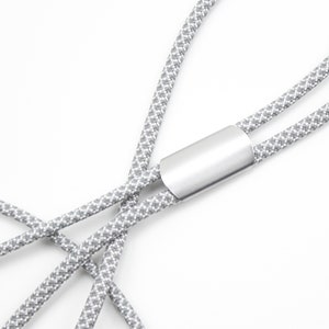 May include: A gray and white patterned lanyard with a silver metal clasp.