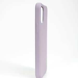 May include: A light purple silicone phone case for a smartphone.