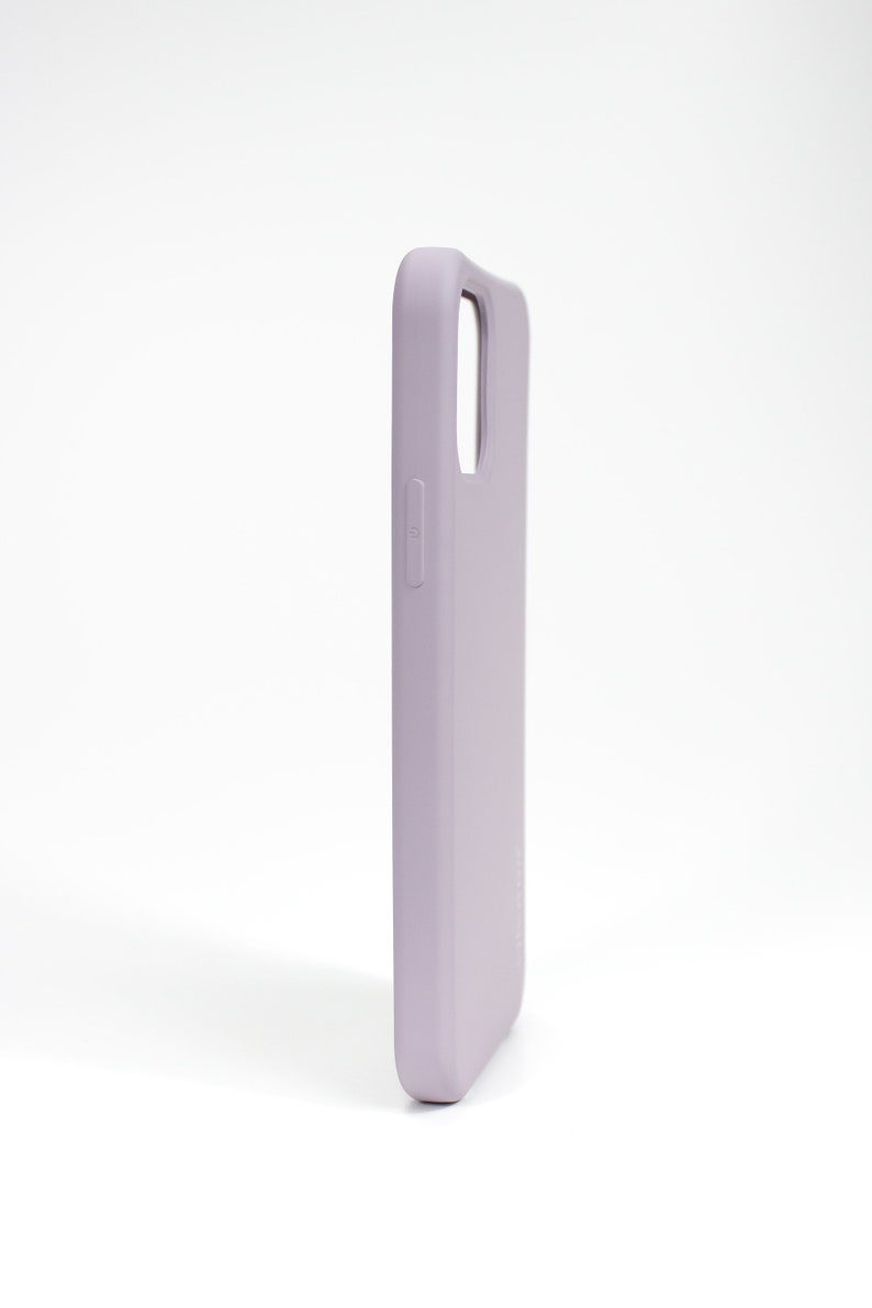 May include: A light purple silicone phone case for a smartphone.