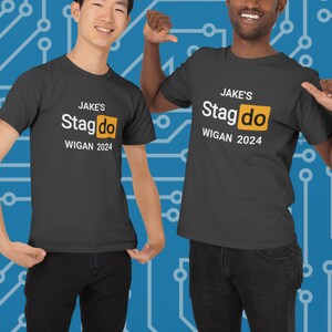 May include: Two black t-shirts with white text that reads "Jake's Stagdo Wigan 2024". The text is centered on the shirt and the word "Stagdo" is in a yellow box.