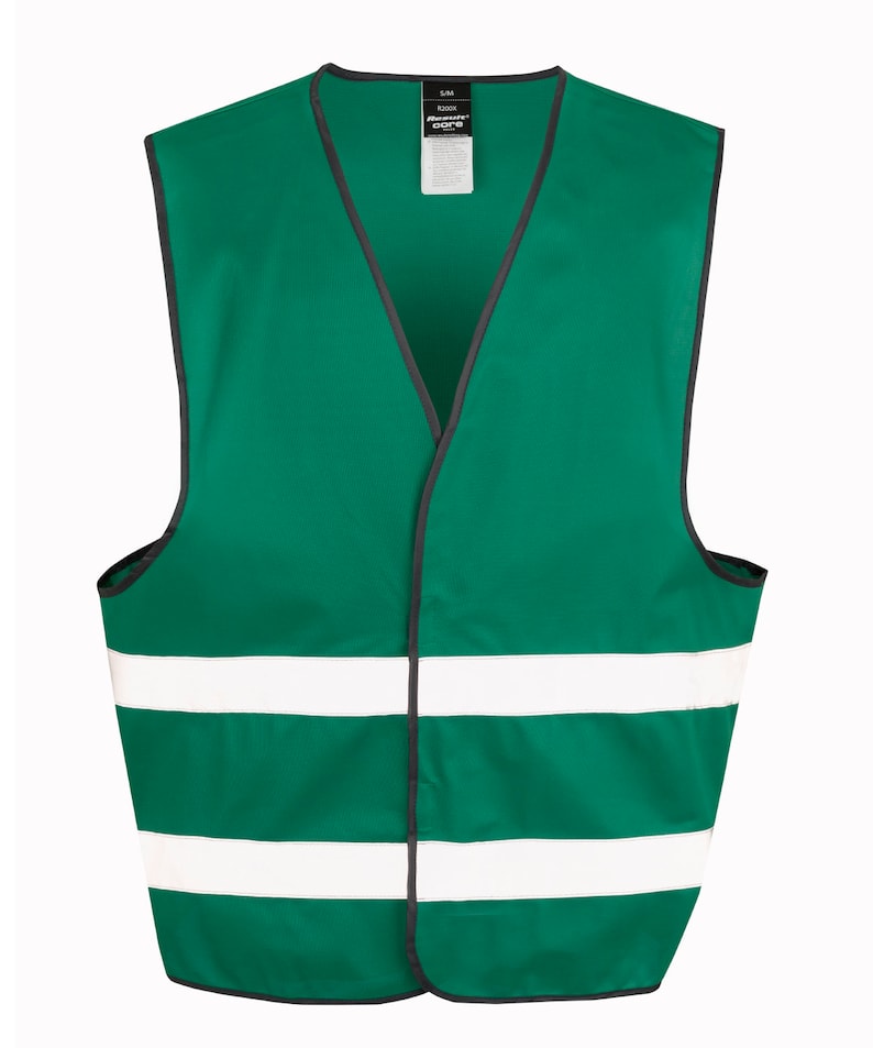 May include: A green safety vest with two white reflective stripes. The vest has a black zipper and a label that says "Ready Core".