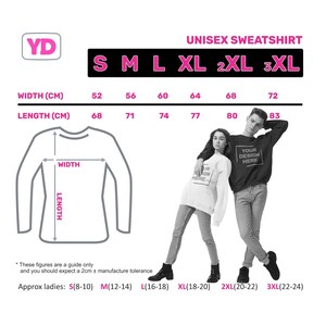 May include: Size chart for a unisex sweatshirt with measurements in centimeters. The chart shows width and length measurements for sizes S, M, L, XL, 2XL, and 3XL. The chart also includes approximate ladies' sizes.