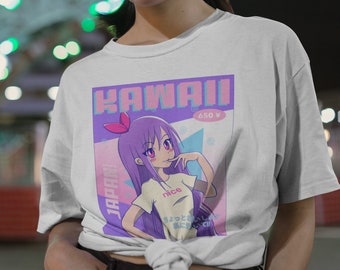May include: White t-shirt featuring a Kawaii anime graphic. The design includes a purple-haired anime girl with the word "KAWAII" in pink and blue text. The shirt also has the word "JAPAN!" printed on it.