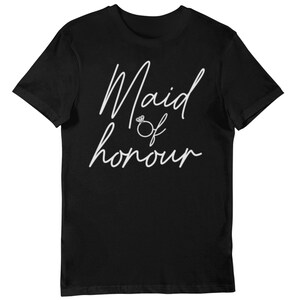 May include: Black t-shirt with the words "Maid of Honour" in white script, with a diamond ring graphic. The shirt is a short-sleeved crew neck style.