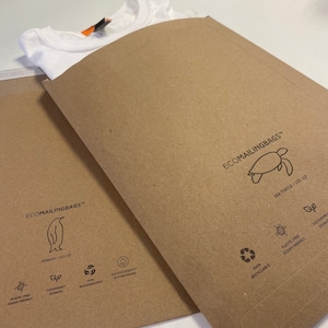 May include: A brown paper mailing envelope with the text "ECOMAILINGBAGS&trade;" and a sea turtle logo. The envelope is 100% recyclable, plastic-free, and ocean-friendly. It is also sustainably sourced and biodegradable.