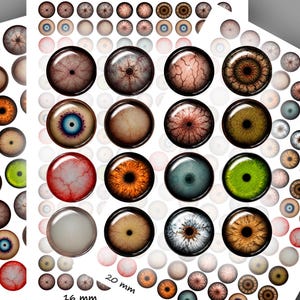 May include: Three sheets of circular glass cabochons featuring realistic human eye designs in various colours including brown, blue, green, and hazel. The sheets are labelled with sizes 16 mm and 20 mm, and include printed web addresses at the bottom.