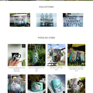 May include: A collection of hand-painted ceramic mugs featuring various designs, including a red panda, a night sky with a bird, a forest scene with animals, and a sheep. The mugs are available for purchase on the Shewolfka website.