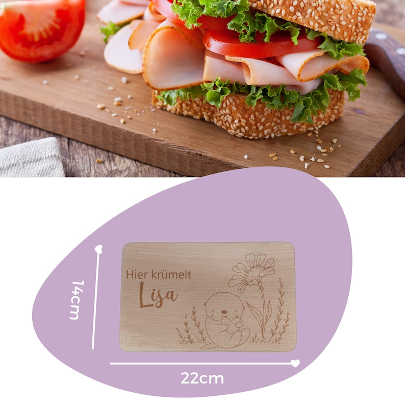 May include: A wooden cutting board with a cute otter design and the text "Hier kr&uuml;melt Lisa". The board measures 22 cm by 14 cm.