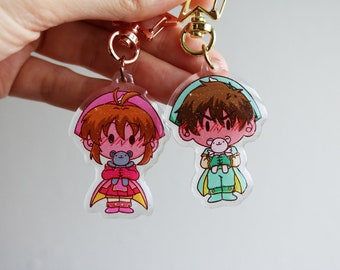 Encantos mágicos de niña y niño / Llavero de doble cara epoxi con brillo transparente / Encanto de anime a juego para parejas