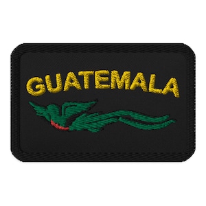 May include: Black embroidered patch with the word "GUATEMALA" in yellow thread and a green bird with a red breast.