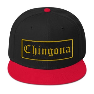 May include: Black and red baseball cap with a gold embroidered rectangle that says "Chingona" in a gothic font.