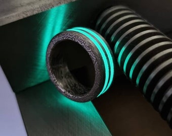 The Burning Dragon. Dragonskin Damascus Steel. Hightech luminous rings. Fully customizable. Made of a highest quality Stainless D-Steel.