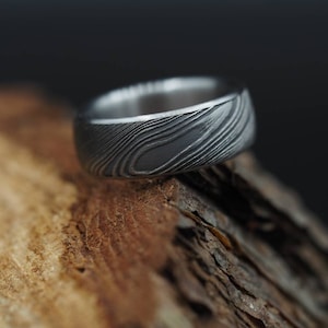 Exclusive, luxurious and highest quality Damascus Steel lined in Stainless Steel. Hypoallergenic. Customizable.
