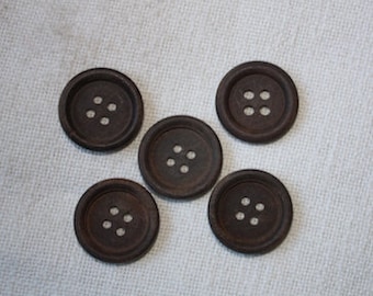 May include: Five brown wooden buttons with four holes each.