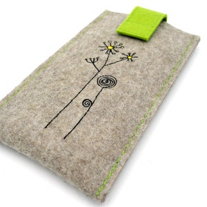 May include: A gray felt phone case with a green felt flap closure. The case has a simple embroidered design of a flower with a yellow center.