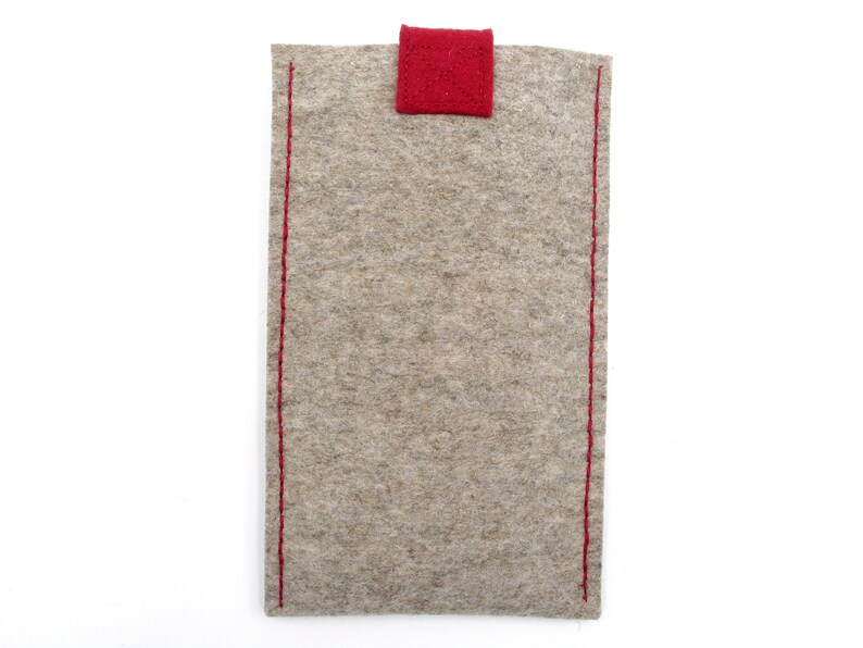 May include: A gray felt pouch with red stitching and a red felt flap.