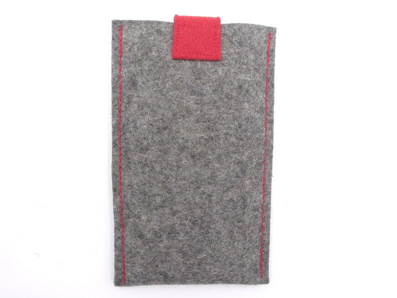 May include: A grey felt phone case with red stitching and a red felt flap.