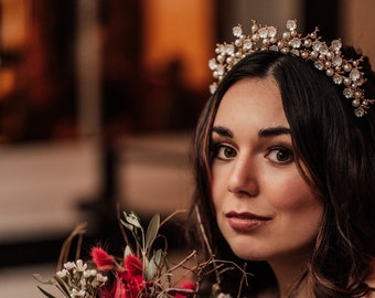 golden crown in gold with pearls and flowers