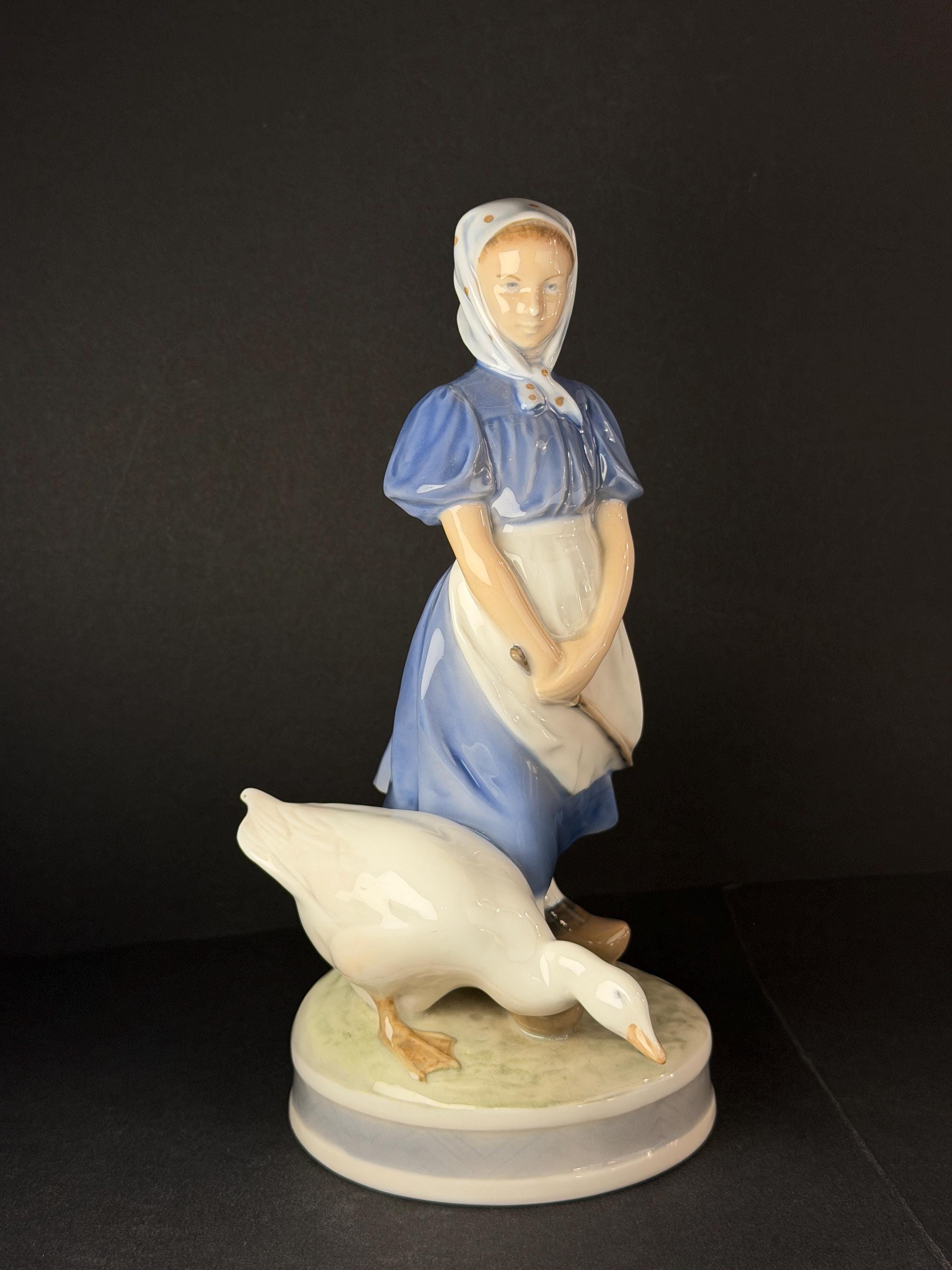 Porcelain Figurine of a Girl with a Doll, Royal Copenhagen, Denmark at