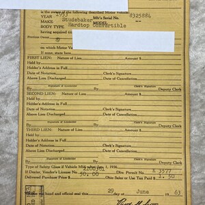 May include: A vintage Ohio Certificate of Title for a 1953 Studebaker Hardtop Convertible. The document is aged, with handwritten details, including the vehicle's serial number and purchase price.