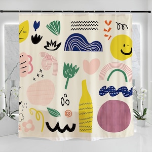 May include: A shower curtain with a white background and colorful abstract shapes, including a yellow smiley face, a green leaf, a blue wave, and a pink heart.