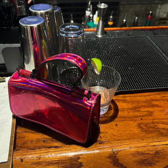 Pink metallic top handle mini purse