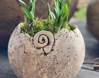 Planter with snail ornaments