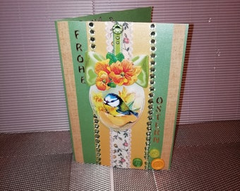 Easter card in green and yellow with an egg and a small songbird