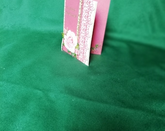 Birthday card for a woman in pink with a rose