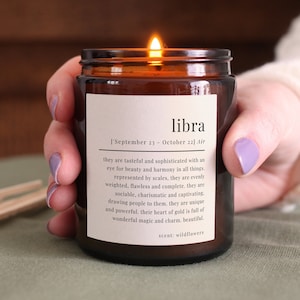Libra star sign candle - Glass jar with a Libra definition printed on the label.