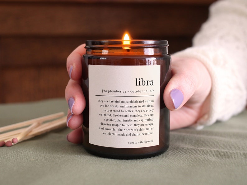 Libra star sign candle - Glass jar with a Libra definition printed on the label.