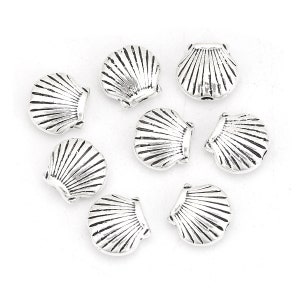 May include: Eight silver-toned metal seashell charms. Each charm is a detailed representation of a seashell with a textured surface.