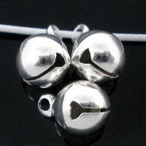 May include: Three silver jingle bells with a small loop for attaching to a project.