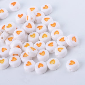 50 x Acryl Perlen Herz Weiß Orange 7mm