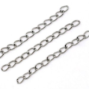 May include: Three silver chains, each approximately 10 inches long, with a classic oval link design.