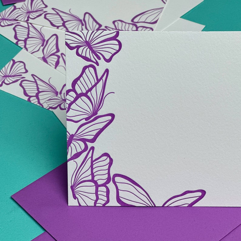 A set of Letterpress Printed Note Cards with Butterflies printed on the side.