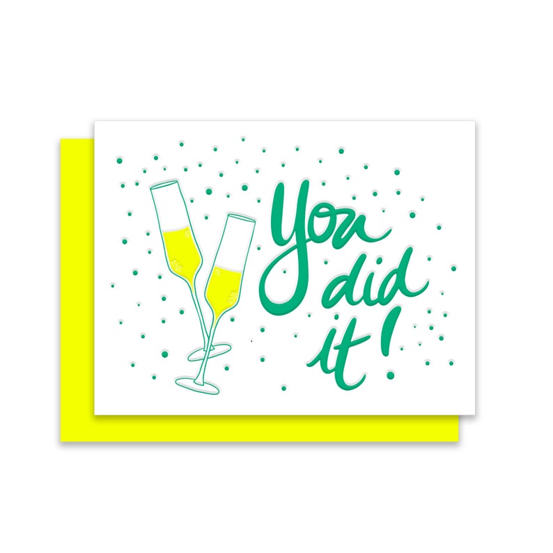 An image of a congratulations card with the word You did it and the image of two champagnes glasses with a yellow envelope.