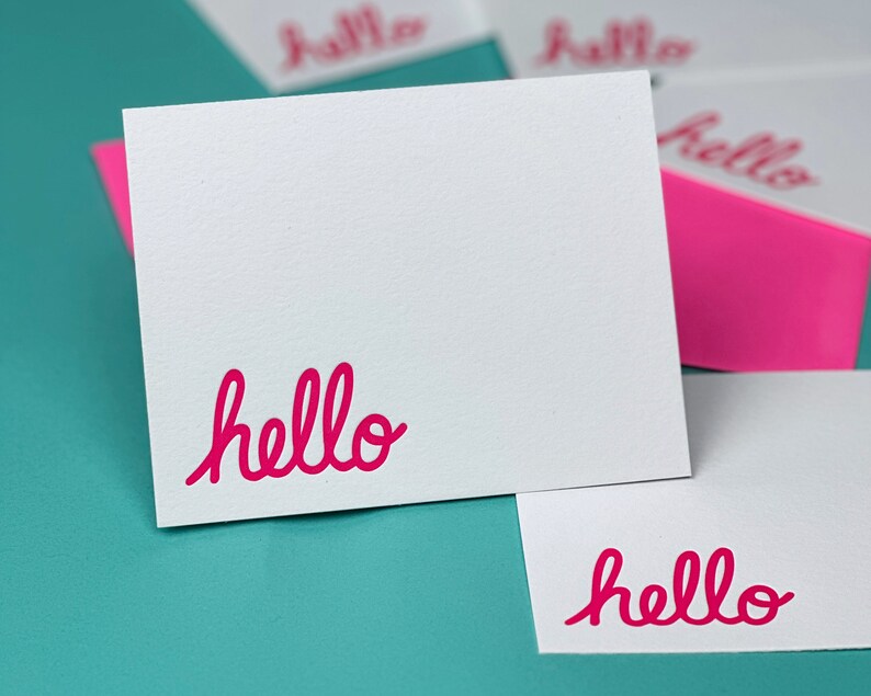 Letterpress Stationery with the work hello printed in pink in the bottom left corner