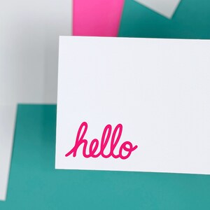 A great gift for your best friend. Letterpress notecards with the word hello printed in pink in the bottom left corner.