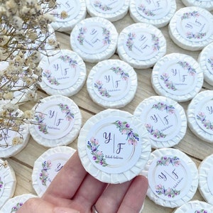 May include: White round soaps with floral designs and the text "Y | F Nikah Balirası" printed on them.